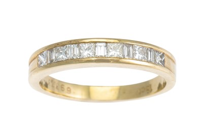 Lot 195 - A DIAMOND HALF ETERNITY RING, the channel set...