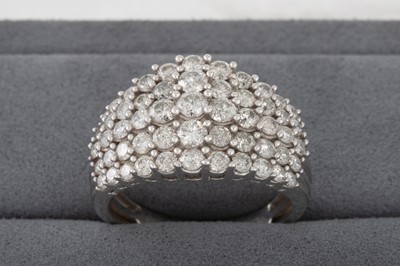 Lot 82 - A DIAMOND DRESS CLUSTER RING, mounted in 9ct...