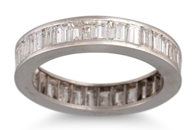 Lot 318 - A BAGUETTE DIAMOND SET ETERNITY RING, channel...