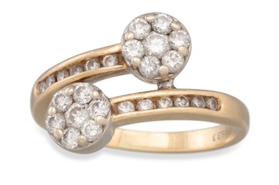 Lot 277 - A DIAMOND RING, of cross-over form, set with...