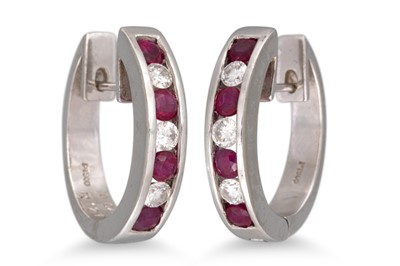 Lot 328 - A PAIR OF DIAMOND AND RUBY EARRINGS, channel...