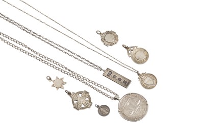 Lot 480 - AN ASSORTMENT OF SILVER MEDALS, an ingot, a...