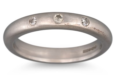 Lot 37 - A PLATINUM DIAMOND SET BAND RING, 6.3 g., size K