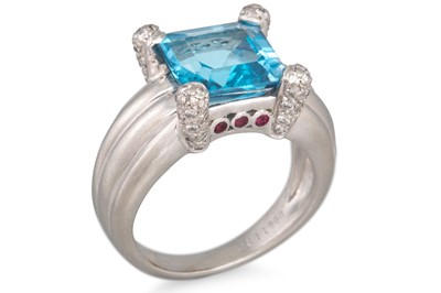 Lot 216 - A TOPAZ AND DIAMOND RING, mounted in platinum,...