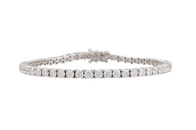 Lot 290 - A DIAMOND LINE BRACELET, the brilliant cut...