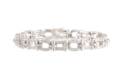 Lot 279 - A DIAMOND SET BRACELET, the open work links...