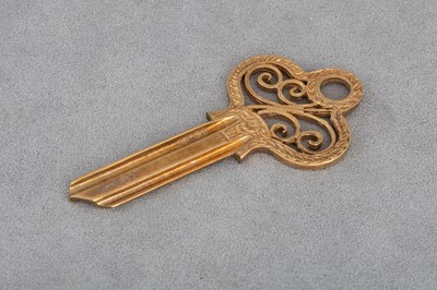 Lot 176 - A MODERN 9CT GOLD KEY BLANK, boxed, unused,...
