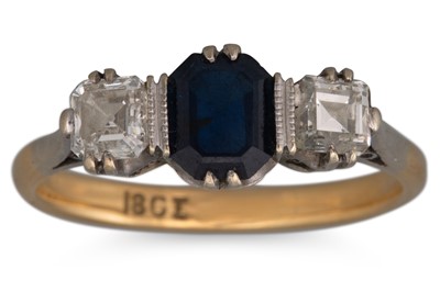 Lot 230 - A SAPPHIRE AND DIAMOND THREE STONE RING, the...