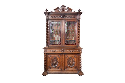 Lot 165 - A VICTORIAN CARVED OAK GLAZED BOOKCASE, carved...