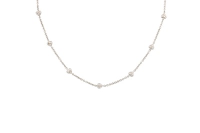 Lot 377 - A DIAMOND SET CHAIN, the heart shaped spacers...