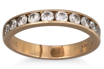 Lot 1 - A DIAMOND CHANNEL SET RING, mounted in 14ct...