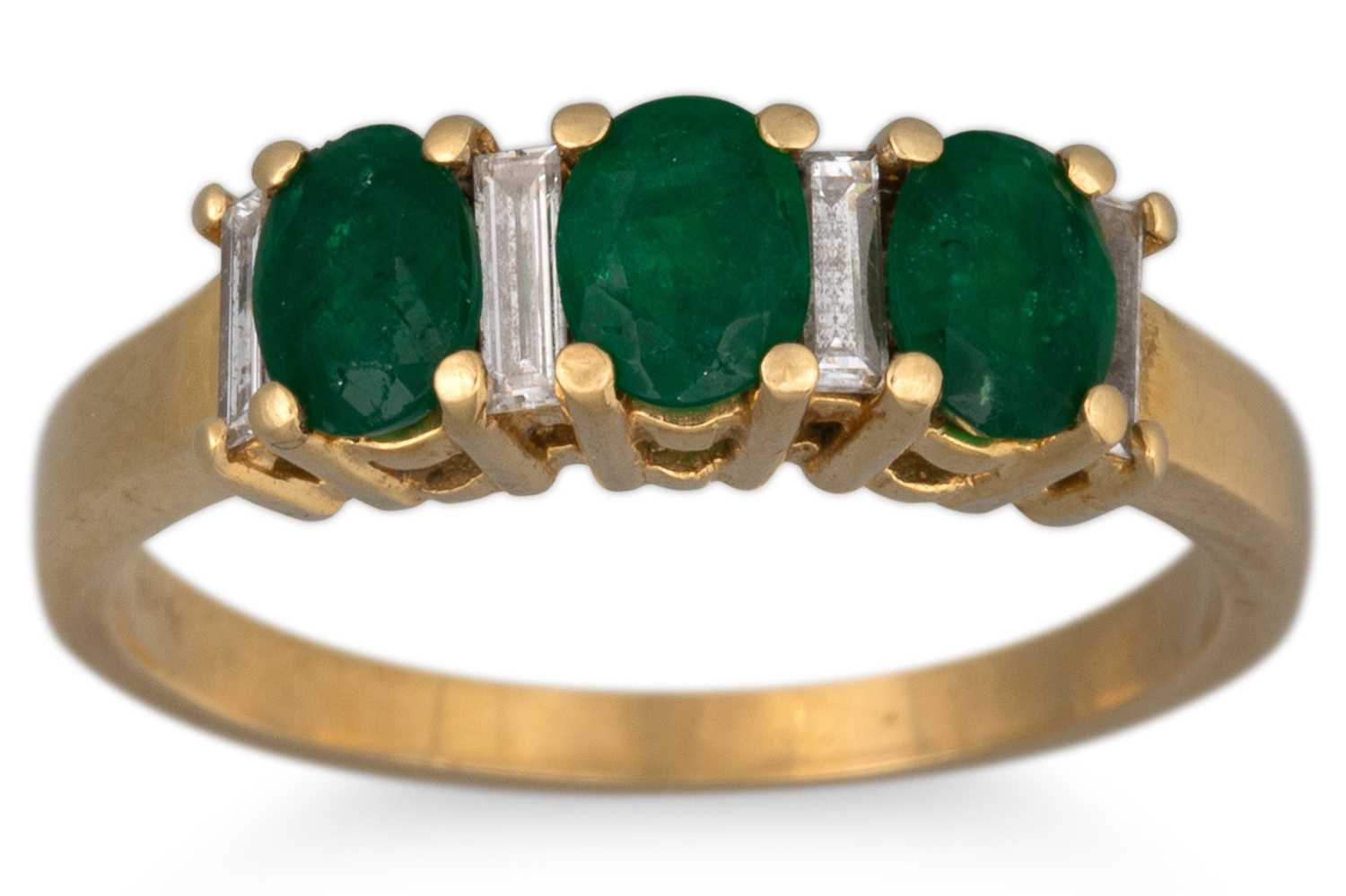 Lot 6 - AN EMERALD AND DIAMOND THREE STONE RING,...