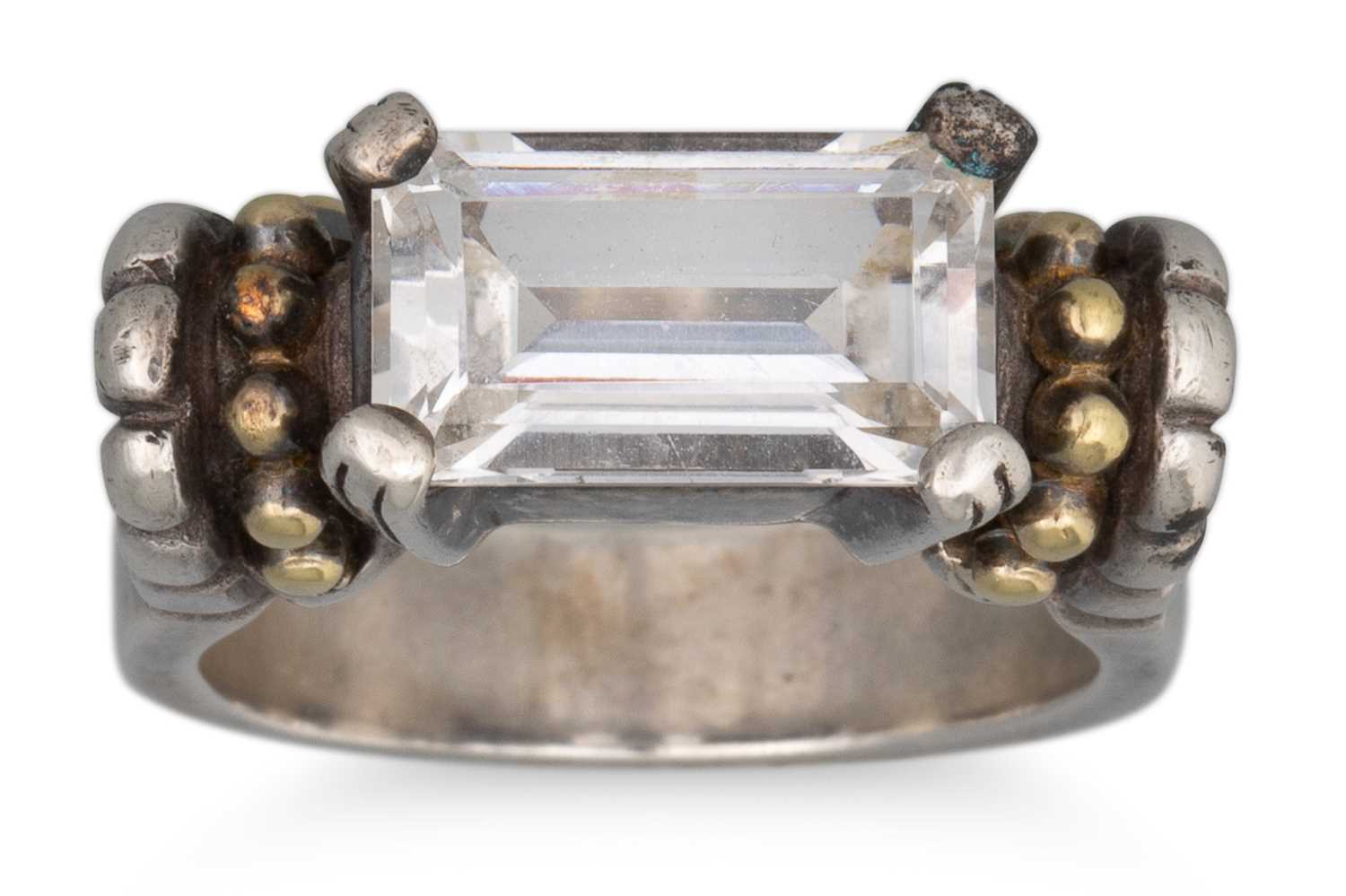 Lot 77 - A TOPAZ SET SILVER RING, with 18ct gold...
