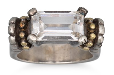 Lot 101 - A TOPAZ SET SILVER RING, with 18ct gold...