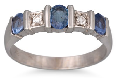 Lot 48 - A DIAMOND AND SAPPHIRE RING, the three oval...