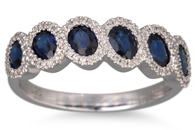 Lot 58 - A DIAMOND AND SAPPHIRE RING, the six oval...