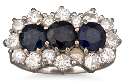 Lot 93 - A DIAMOND AND SAPPHIRE CLUSTER RING, the three...