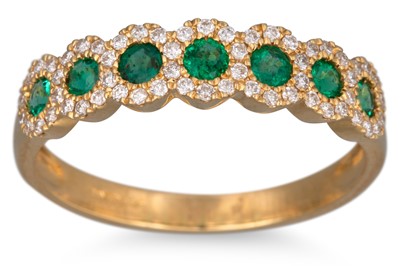 Lot 97 - A DIAMOND AND EMERALD RING, the round emeralds...