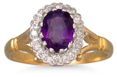 Lot 117 - A DIAMOND AND AMETHYST CLUSTER RING, the oval...