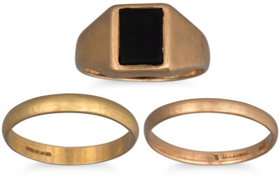 Lot 14 - THREE GOLD RINGS, one 9ct with onyx, one 18ct...