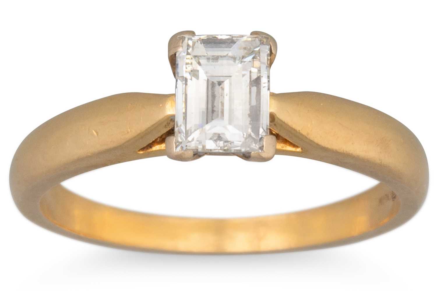 Lot 40 - AN EMERALD CUT DIAMOND SOLITAIRE RING, mounted...