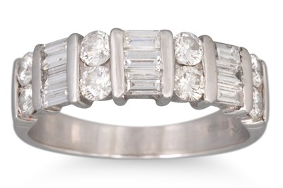 Lot 10 - A DIAMOND BAND RING, set with baguette and...