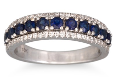 Lot 11 - A DIAMOND AND SAPPHIRE THREE ROWED RING,...