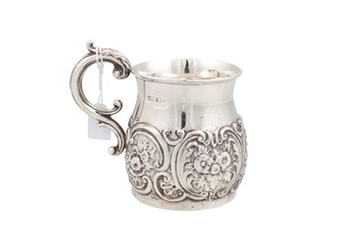 Lot 528 - AN EDWARDIAN SILVER EMBOSSED CHRISTENING MUG,...