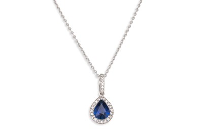 Lot 163 - A DIAMOND AND SAPPHIRE DROP PENDANT, the pear...
