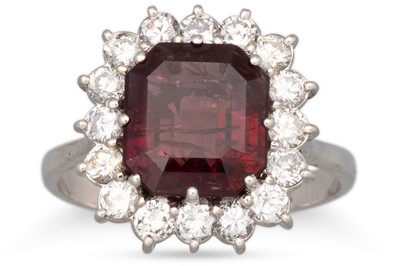 Lot 136 - A RUBY AND DIAMOND CLUSTER RING, the  cushion...