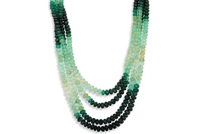Lot 140 - A THREE STRANDED FACETED BEADED EMERALD...