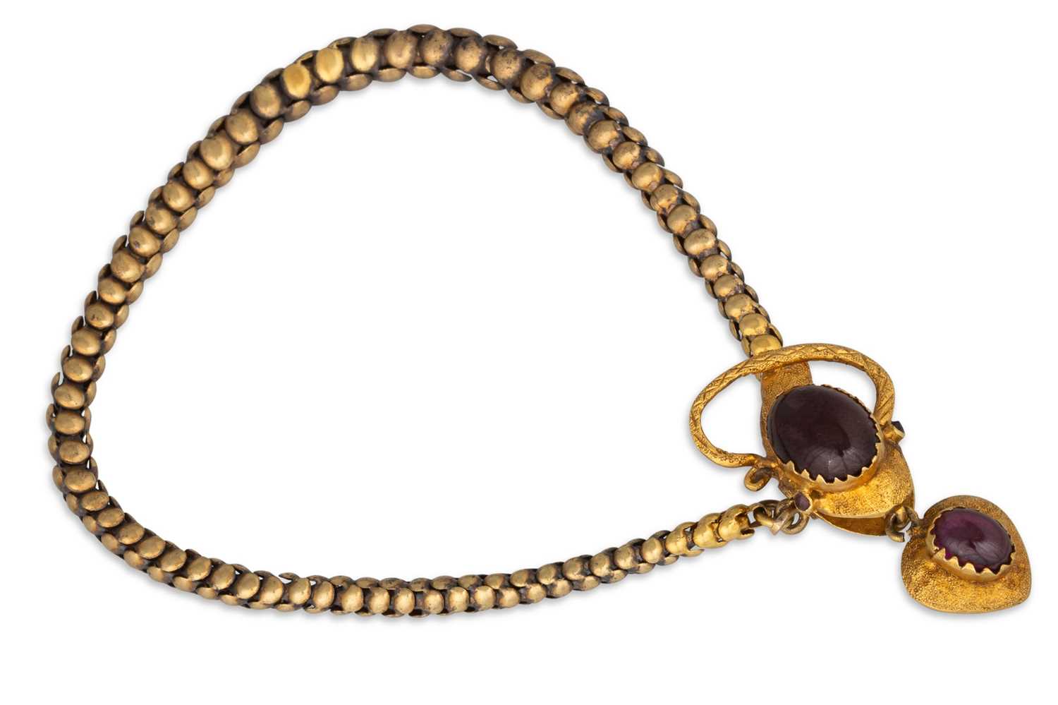Lot 29 - A GOLD VICTORIAN SNAKE BRACELET, garnet set...