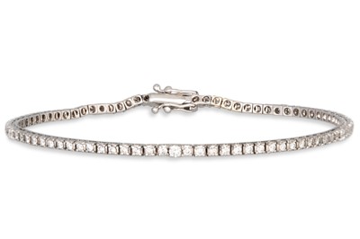 Lot 189 - A DIAMOND LINE BRACELET, the brilliant cut...