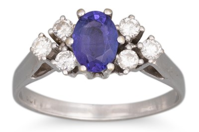 Lot 125 - A TANZANITE AND DIAMOND RING, the oval...