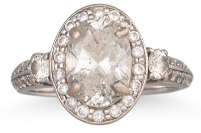 Lot 314 - A DIAMOND SOLITAIRE RING, the oval diamond to...