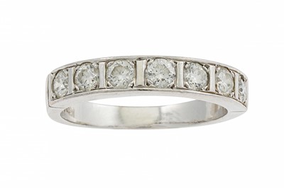 Lot 225 - A SEVEN STONE DIAMOND RING, the brilliant cut...