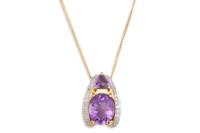 Lot 12 - AN AMETHYST AND DIAMOND PENDANT, the oval and...