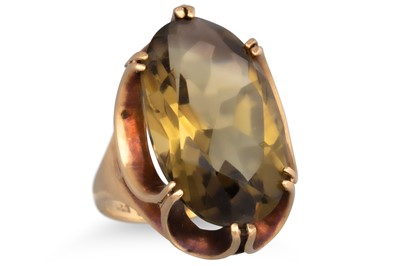 Lot 25 - A QUARTZ COCKTAIL RING, the large oval quartz...