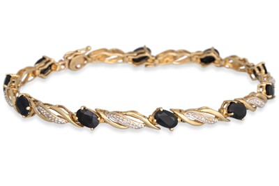 Lot 28 - A SAPPHIRE AND DIAMOND BRACELET, the oval...