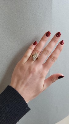 Lot 52 - A BOAT SHAPED DIAMOND CLUSTER RING, set with...