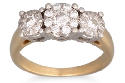 Lot 56 - A DIAMOND TRIPLE CLUSTER RING, the three...