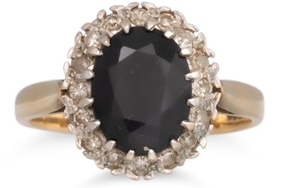 Lot 60 - A SAPPHIRE AND DIAMOND RING, the oval sapphire...
