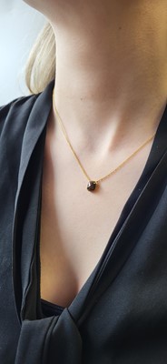 Lot 92 - A COLOURED DIAMOND PENDANT, mounted in 14ct...