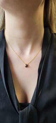 Lot 92 - A COLOURED DIAMOND PENDANT, mounted in 14ct...