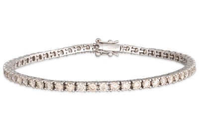 Lot 228 - A DIAMOND LINE BRACELET, the brilliant cut...