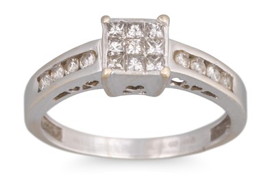 Lot 122 - A DIAMOND CLUSTER RING, set with princess cut...