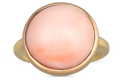 Lot 217 - A CORAL RING, the cabochon pink coral to a...