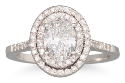 Lot 241 - A DIAMOND 'HALO' CLUSTER RING, the oval centre...