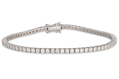 Lot 212 - A DIAMOND LINE BRACELET, the brilliant cut...