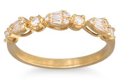 Lot 231 - A DIAMOND SET HALF ETERNITY RING, set with...